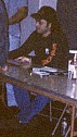 Robert signing autographs